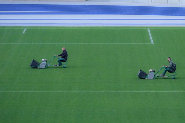 2023's top-rated riding lawn mower, Hubcity XR500, with advanced tech and robust design, cutting through a lush green lawn under a clear blue sky.